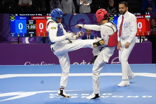 Daniel Balli (blue) competing for Jamaica at the 2026 World Taekwondo Junior Championships, Tashkent