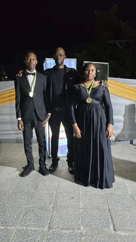 Master Kenroy Clarke with WTM medallists at the RJR Gleaner National Sports Awards