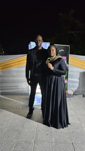 Master Kenroy Clarke with a WTM medallist at the RJR Gleaner National Sports Awards